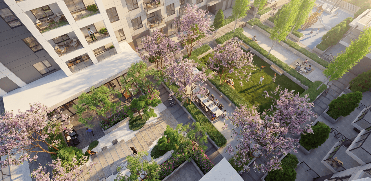 Kamilia central courtyard between two six-storey residential buildings in Downtown Langley